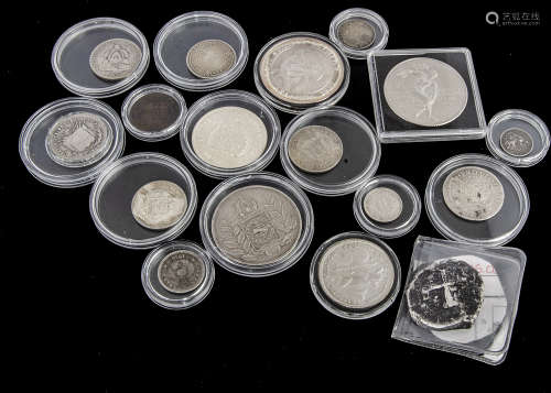 A small collection of interesting coins, including an antique 8 reals piece of eight style coin, and