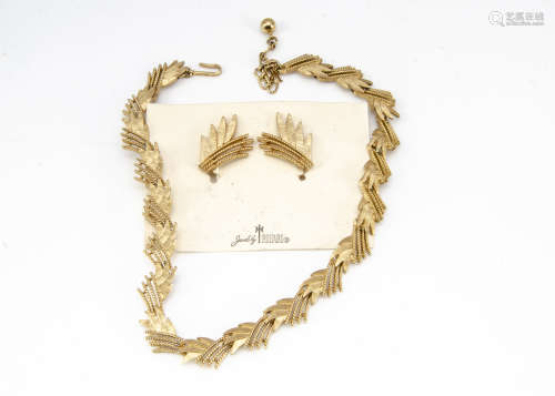 A Trifari gilt metal necklace and earring set, of stylised palm leaf design, 40cm long, boxed