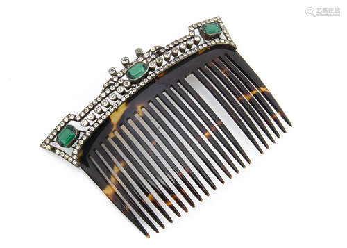 An early 20th Century continental tortoiseshell and paste set base metal mounted hair comb, the