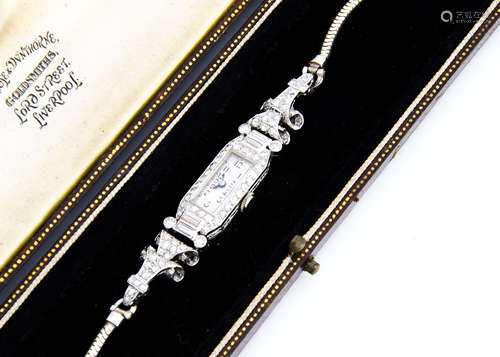 An Art Deco period platinum and diamond lady's cocktail dress wristwatch, 10mm wide, 64mm long,