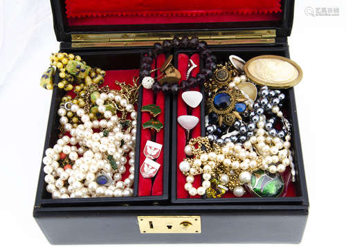 A quantity of costume jewels, including simulated pearls, brooches, bracelets etc in a black leather