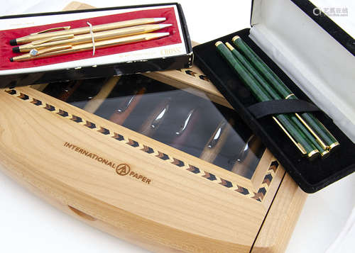 A collection of pens, including two Cross gold plated biros and a retractable pencil, a set of