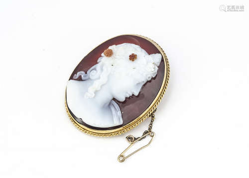 An early 19th Century sardonyx cameo brooch, modelled as the profile of a classical figure with