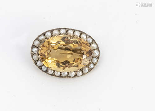 A 9ct gold citrine and pearl bezel oval brooch, the claw set citrine with crown gallery and half