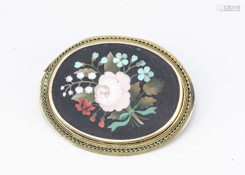 A 19th Century pietra dura and yellow metal oval brooch, the inlaid panel decorated with a central