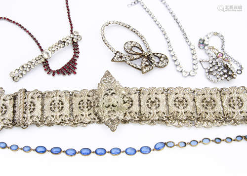 A collection of paste set costume jewellery, including a silver plated ornate and pierced embossed