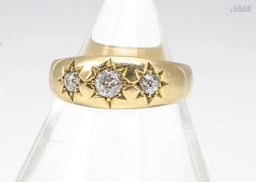 A Victorian 18ct gold three stone diamond ring, the three old cuts in gypsy setting dated Birmingham