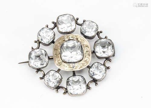 A 19th Century paste, white metal and gold sunburst brooch, with cushion cut paste stones, central