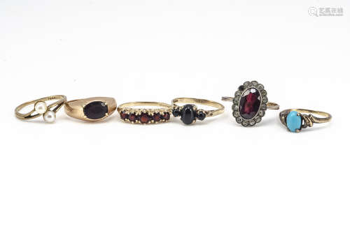 A collection of 9ct gold dress rings, including a five stone garnet ring, a garnet signet ring,