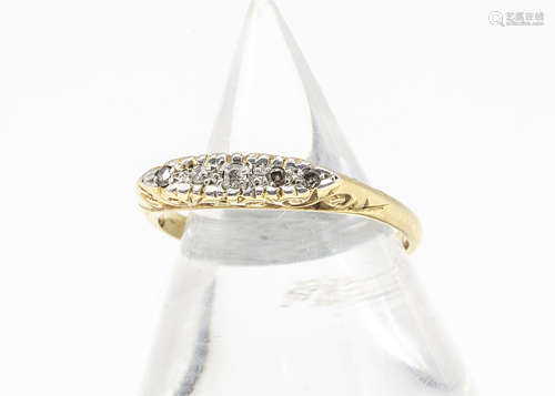 A five stone diamond 18ct gold and platinum dress ring, the five eight cuts within platinum on a