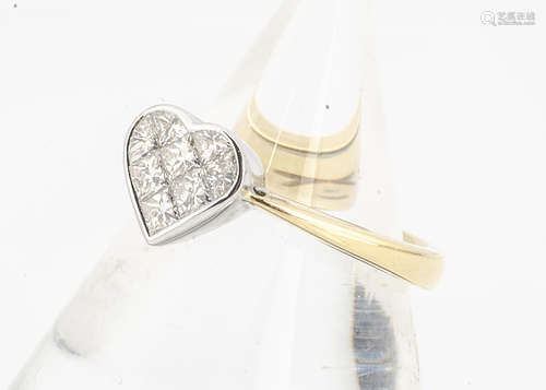 A contemporary 18ct gold heart shaped diamond set dress ring, the princess cuts in white heart on