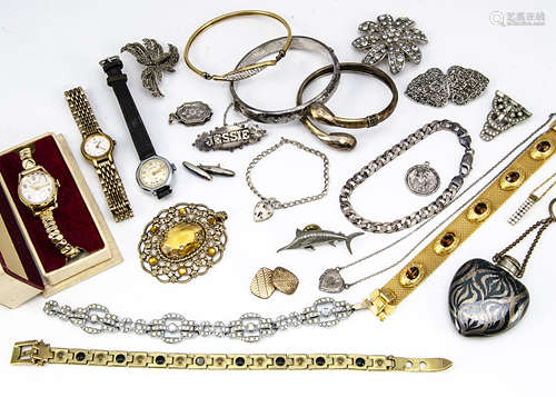 A quantity of costume jewels, including two bangles a curb link bracelet, a bar brooch with the name