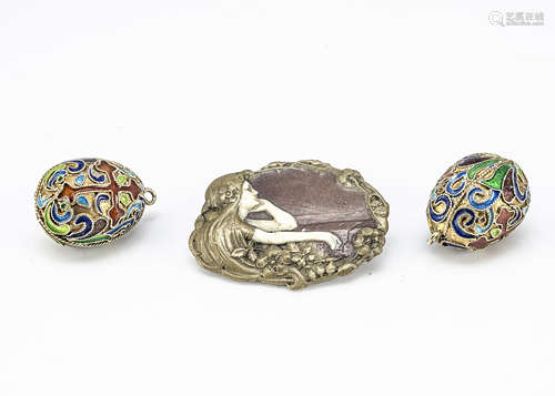 Two gilt metal and cloisonne egg shaped pendants, decorated with a red orthodox cross, with circular