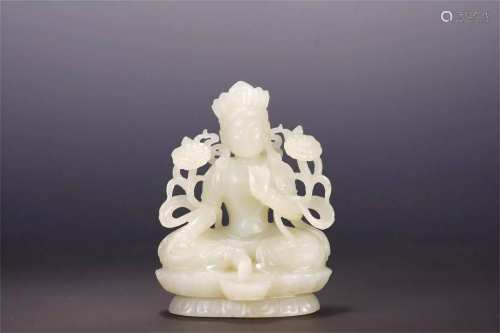 A CHINESE WHITE JADE LOTUS HAND GUANYIN SEATED STATUE