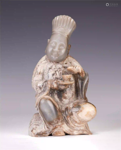 A CHINESE JADE FIGURE-SHAPED ITEM