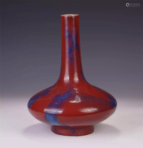 A CHINESE WARE RED GLAZE VASE