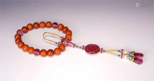 A CHINESE AMBER 18 BEADS HAND HELD ROSARY