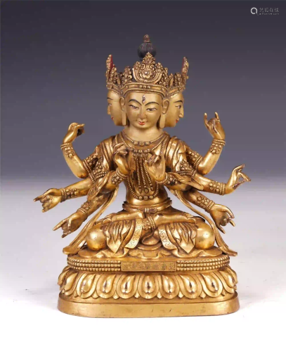 A CHINESE GILT BRONZE EIGHT ARMS GUANYIN SEATED STAT…
