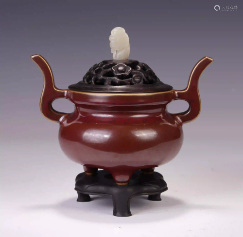 A CHINESE RED AND GLAZE TRIPLE FEET DOUBLE HANDLE
