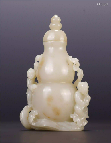 A CHINESE CARVED BOY HANDLE WHITE JADE GOURD VASE
