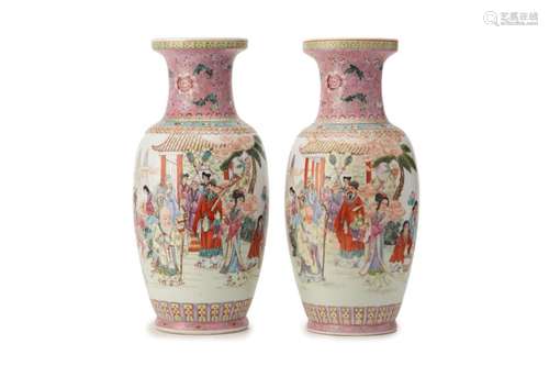 A PAIR OF PINK GROUND FAMILLE ROSE BALUSTER VASES