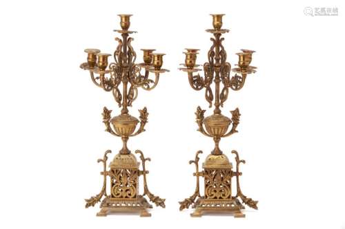 A PAIR OF GILT BRASS FIVE-LIGHT CANDELABRA