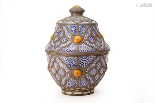 A LARGE METAL-MOUNTED MOROCCAN POTTERY JAR AND COVER