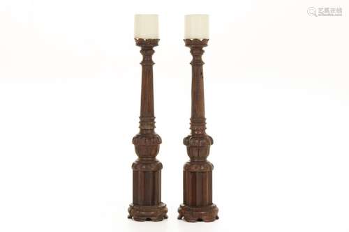 A PAIR OF LARGE TURNED AND CARVED WOOD PRICKET CANDLESTICKS