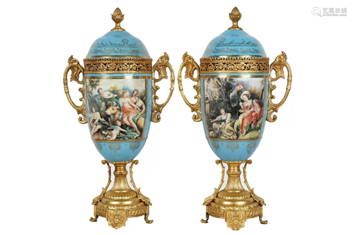 PAIR OF GILT METAL MOUNTED PORCELAIN URNS