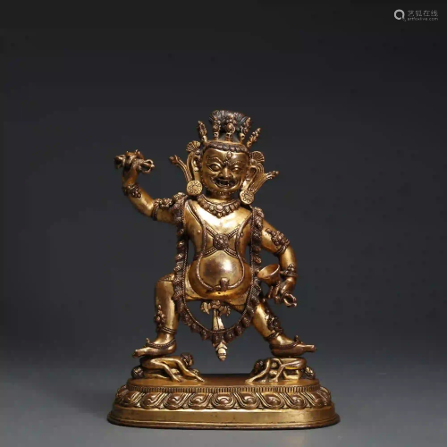 A 15th Century Tibetan Gilt Bronze Figure of Dharma