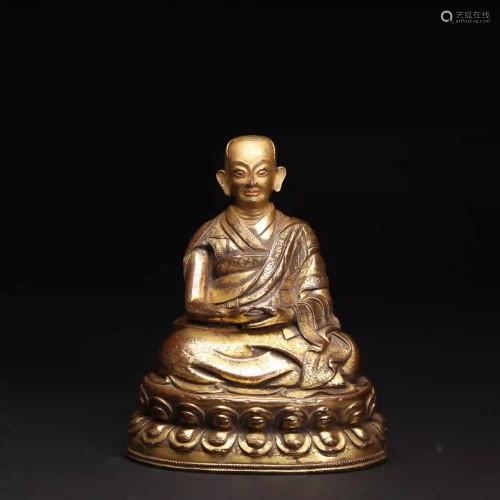 A 12th Century Tibetan Gilt Bronze Figure of Guru