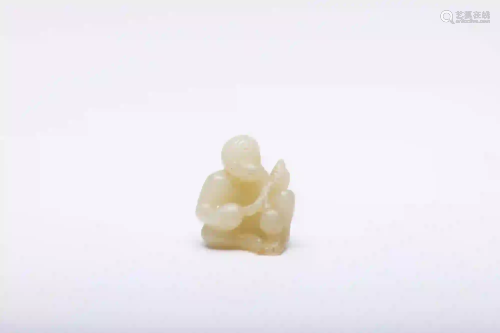 A Carved White Jade Monkey with Peaches Figure Qing