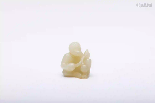 A Carved White Jade Monkey with Peaches Figure Qing