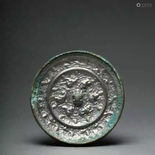 An Auspicious Beasts and Grapes Bronze Mirror Tang
