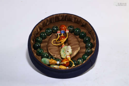 A Chinese Carved Jadeite Bracelet