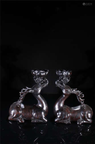 A Pair of Chinese Carved Hardwood Candlesticks