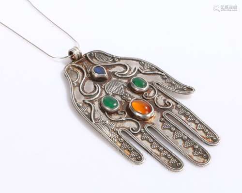 Afghan silver hand pendant, set with four semi-precious stones, on a white metal necklace, the