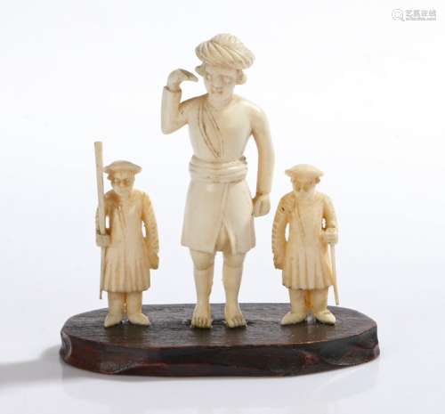 Three carved ivory figures Ivory figures, mounted on a carved wooden base, 7.5cm high