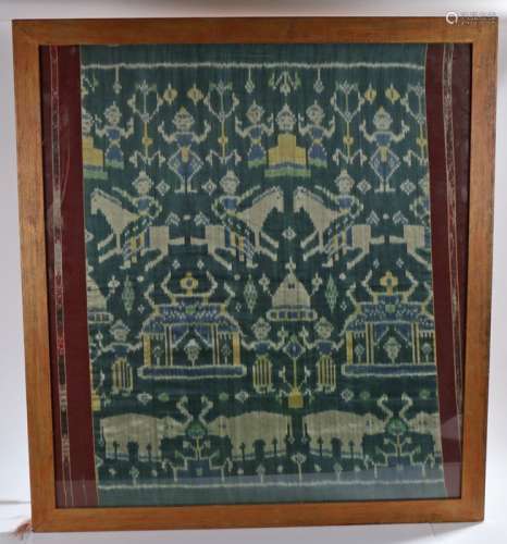 Indonesian textile panel depicting figures, horses and elephants, housed in a glazed hardwood frame,