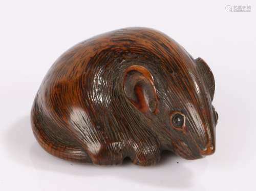 Japanese Edo period netsuke, the wood netsuke carved as a rat curled up upon it's tail and with