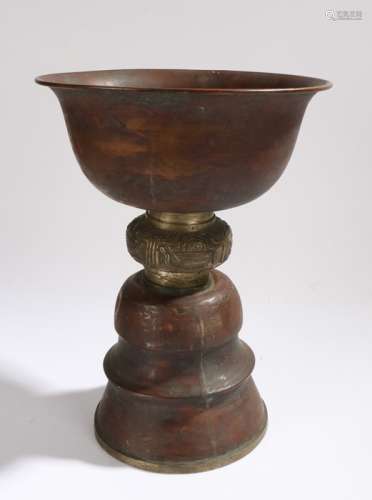 Copper lamp, the bowl form top section above a cast brass stem and stepped copper base, 24.5cm
