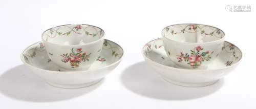 Pair of 18th Century Chinese export porcelain tea bowls and saucers, with foliate and wavy line