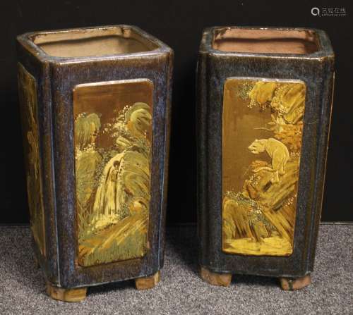 A pair of Chinese floor standing vases, each panel painted in relief, 69cm high