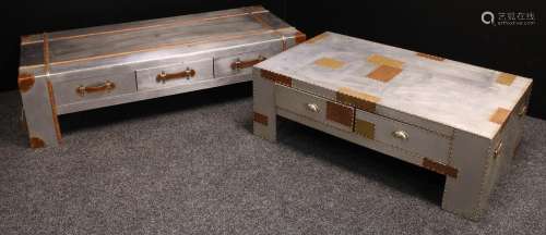 A contemporary coffee table, overlaid with foil, rectangular top above three drawers, further