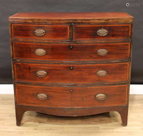 A George IV mahogany bow-fronted chest, of two short and three long graduated cockbeaded drawers,