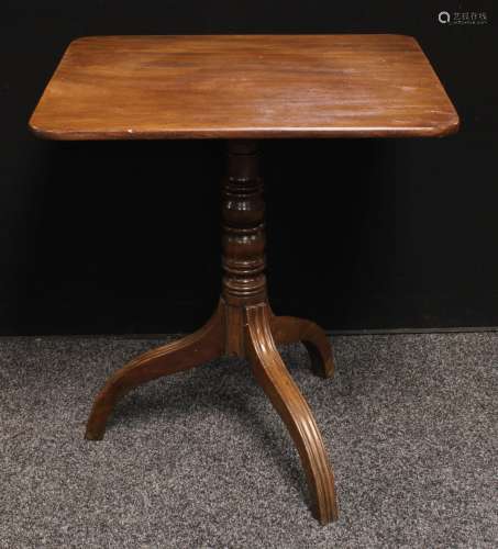 A George III tilt top occasional table, rounded rectangular top, turned column, downswept reeded