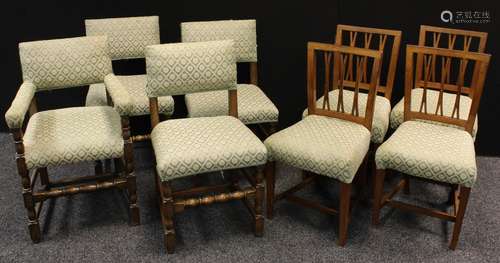 A set of four mahogany dining chairs, stuffed over upholstery, H-stretchers; another set of four oak