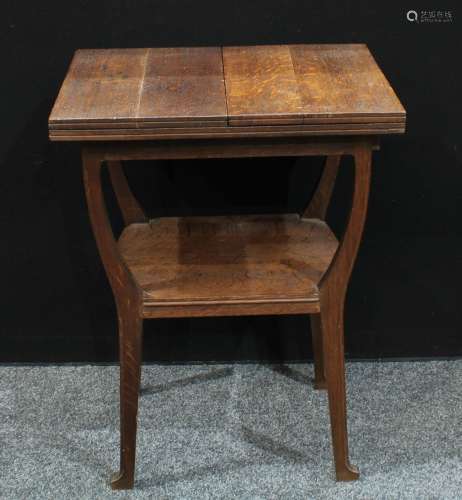 An unusual Aesthetic period oak fold-out occasional table, the rectangular top with twin-hinged