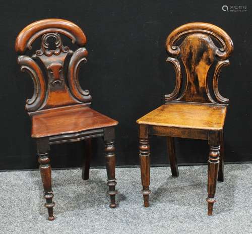 A William IV mahogany hall chair, carverd back, serpentine seat, turned legs, 85cm high; another