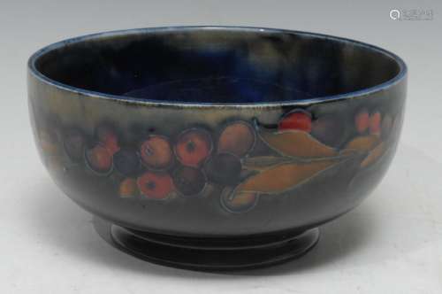 A Moorcroft Pomegranate pattern bowl tube lined with sliced and whole fruit, 16cm diam, impressed